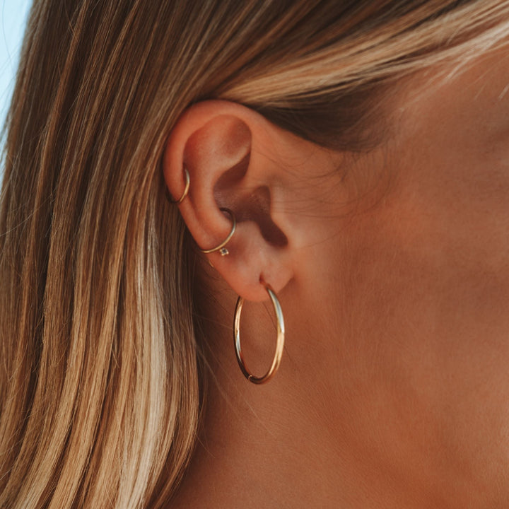 Everyday wear thin hoop earrings for women. Stylish, comfortable, and versatile gold or silver hoops.