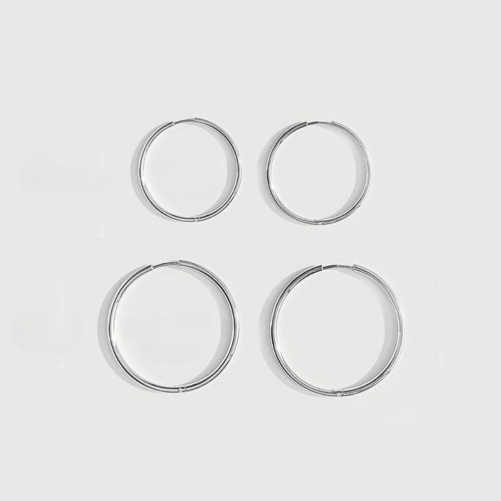 Water-resistant thin hoop earrings for women. Durable & chic delicate gold or silver hoops for active lifestyles.