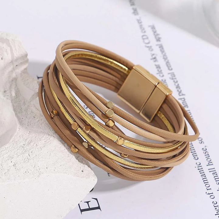 Tri-color multi-layer wrap bracelet with magnetic clasp, stylish and comfortable women's jewelry.