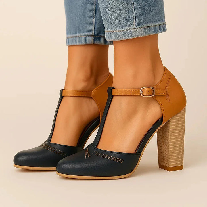 Fashionable women's two-tone block heel pumps with a stable block heel for comfort and modern style.