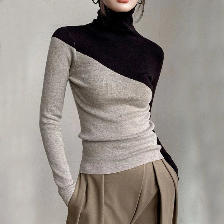 Elegant long-sleeve women's sweater featuring a unique split-color design, ideal for casual yet stylish wear.