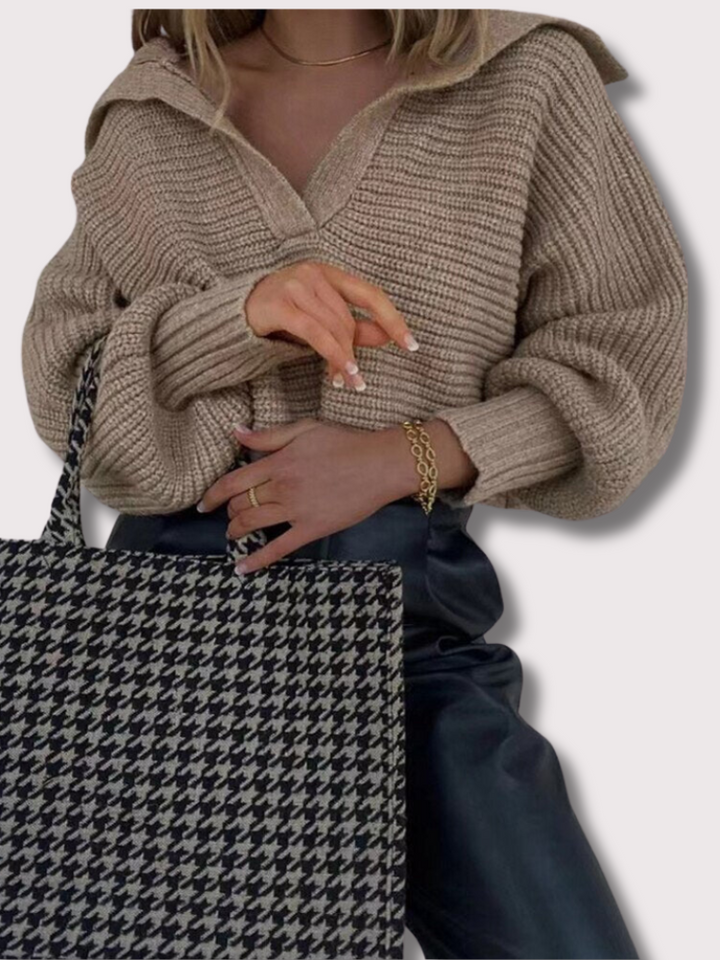 Comfortable loose fit V-neck knitted top for women, versatile for casual wear and elegant styling.