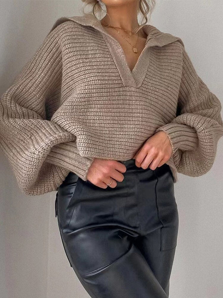 Modern women's V-neck knitted top, comfortable loose fit, ideal for casual and elegant layered looks.