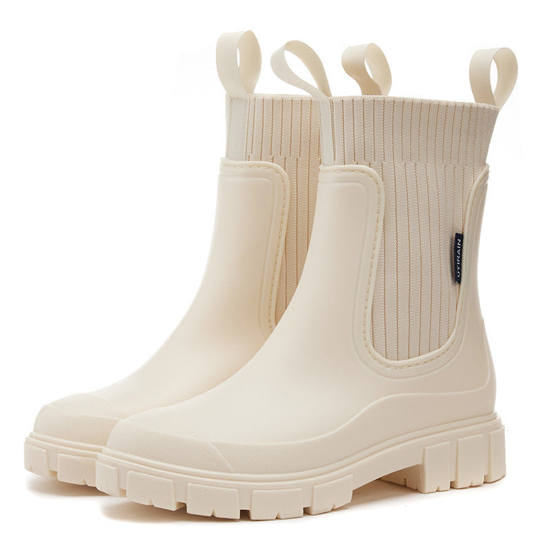 Durable women's rain boots with anti-slip soles, ensuring safety and comfort. Waterproof all-weather outdoor footwear.