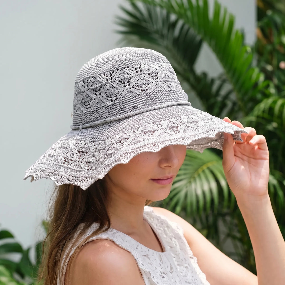 Stylish women's wide brim sun hat for beach, travel, and elegant summer fashion.