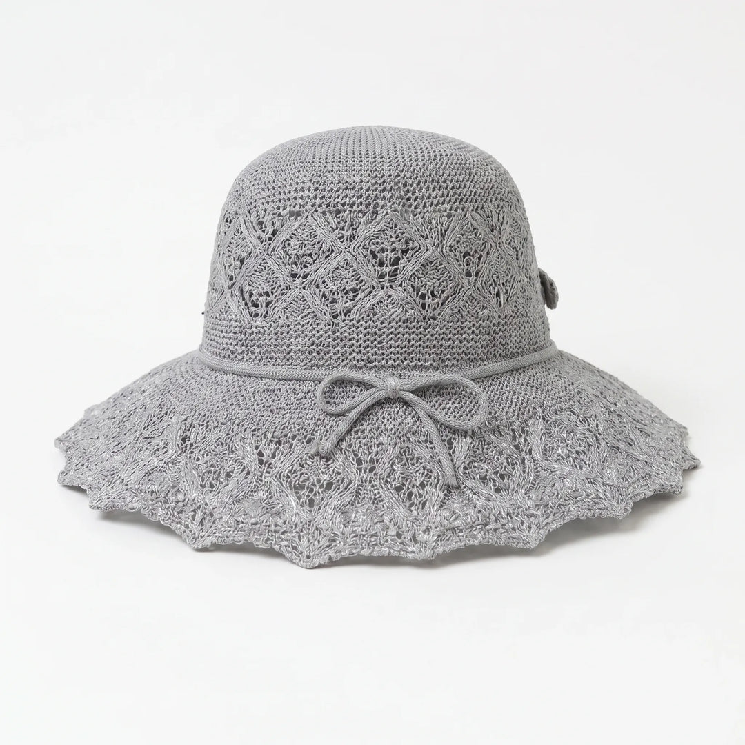 Chic women's wide brim sun hat. A summer fashion essential for beach days & outdoor adventures.