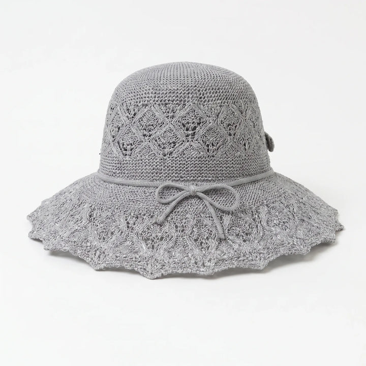 Chic women's wide brim sun hat. A summer fashion essential for beach days & outdoor adventures.