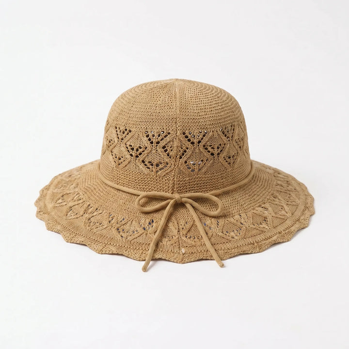 Women's foldable wide brim sun hat, essential for beach, travel, and stylish summer outdoor protection.
