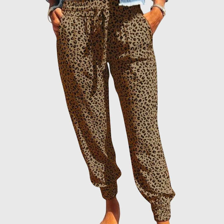Comfortable women's flowy wide leg animal print pants, ideal for elegant casual wear.