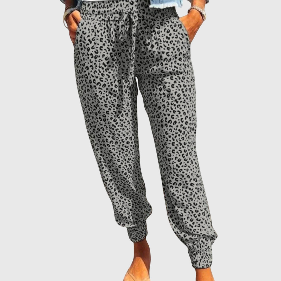 Trendy women's wide leg pants featuring a vibrant wild animal print, offering both style & comfort.