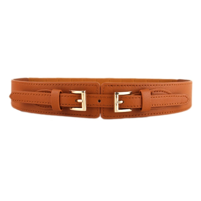 Cinching wide women's PU leather belt, a stylish fashion accessory for dresses and modern looks.