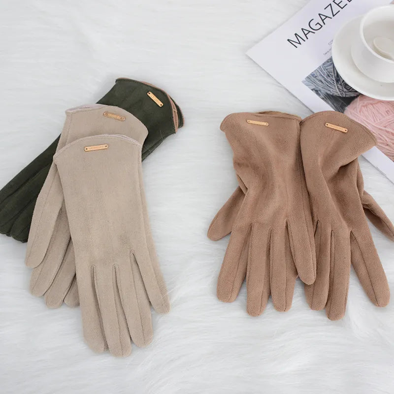 Stylish ladies' winter gloves, keeping hands warm while using touch devices.