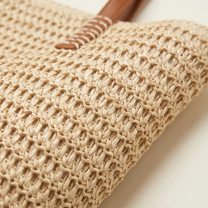 Large capacity beige woven tote bag for women. Versatile shoulder handbag, ideal for beach trips & casual daily use.