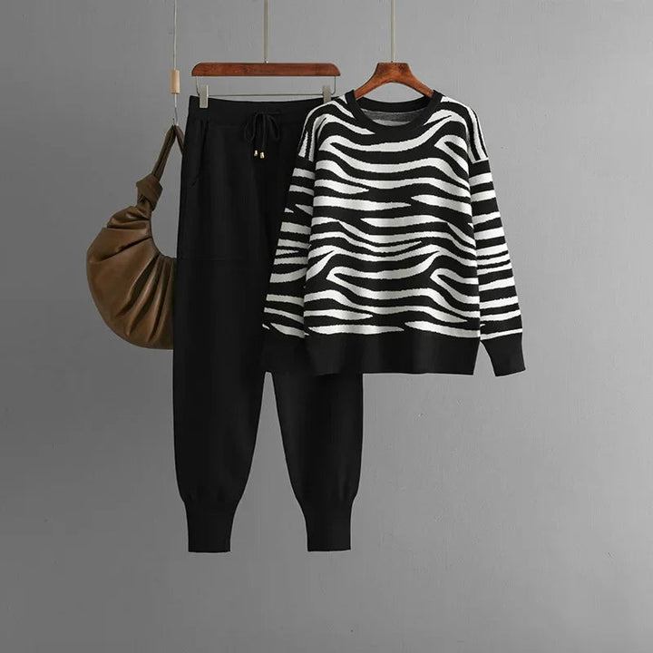 Women's stylish zebra print jogger loungewear set. Comfortable two-piece casual leisurewear.