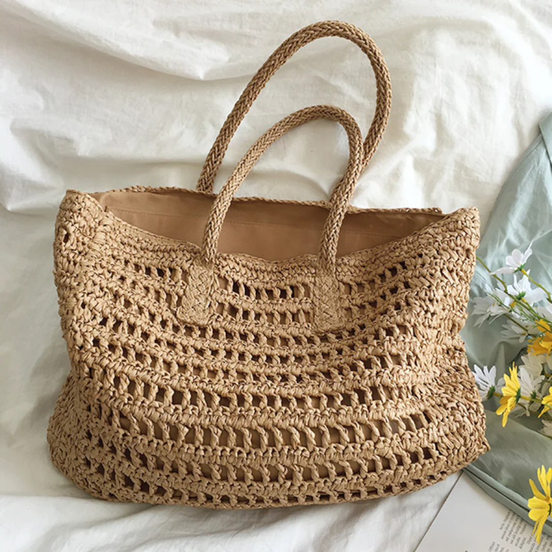 Textured woven women's tote bag, a lightweight and stylish summer accessory ideal for beach and everyday use.