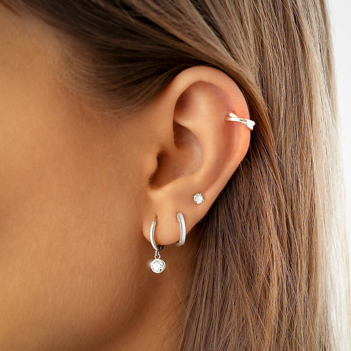 Gold plated and sterling silver Nova hoop earrings, a subtle yet stylish accessory for women. Elegant daily wear.