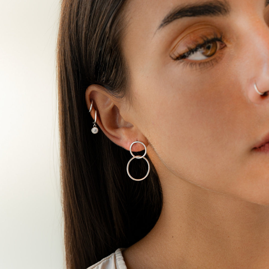 Minimalist women's hoop earrings in silver & gold. Subtle, stylish, and elegant jewelry, perfect as a gift for her.