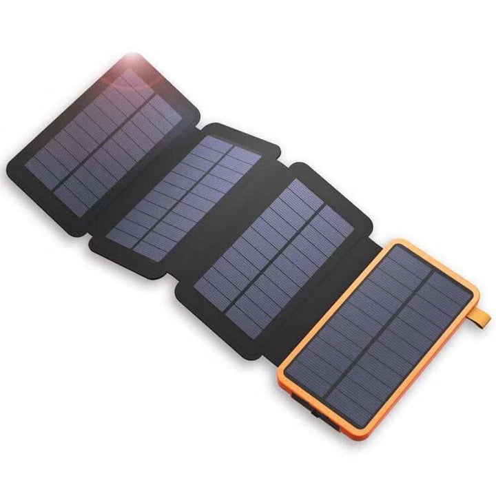 SunCore 4-panel solar power bank charging smartphone outdoors, portable charger with 3 USB outputs