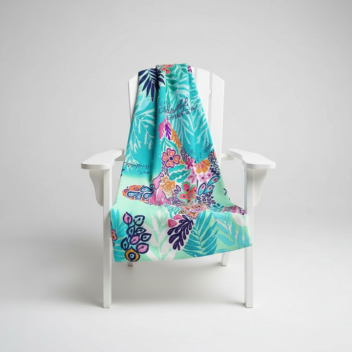 Unisex quick-dry microfiber towel laid out on a sandy beach, demonstrating its sand-free properties
