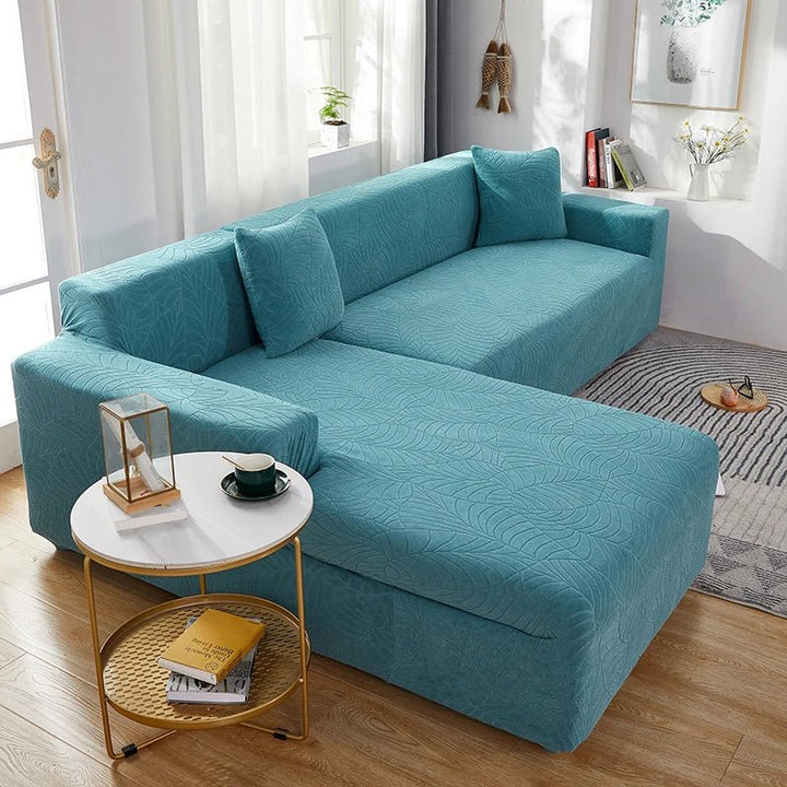 Tailored L-shape sofa slipcover in polyester for sectional furniture protection & living room refresh.