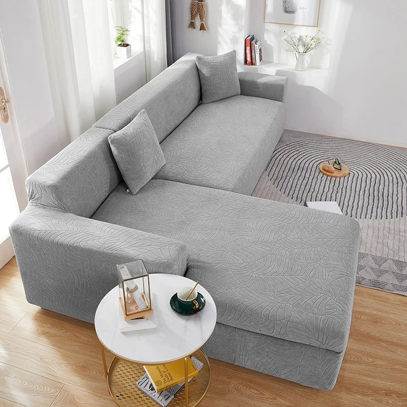 Stretch polyester L-shape sectional sofa cover, easy care & pet friendly. Ideal for home decor.