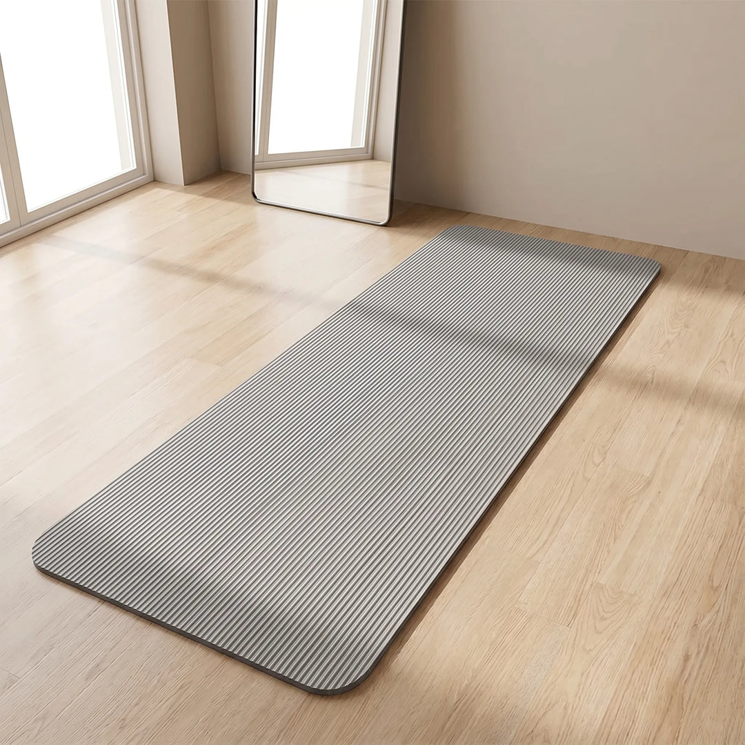 Thick cushioning exercise mat for comfortable home workouts & joint protection. Non-slip fitness mat, unisex design.