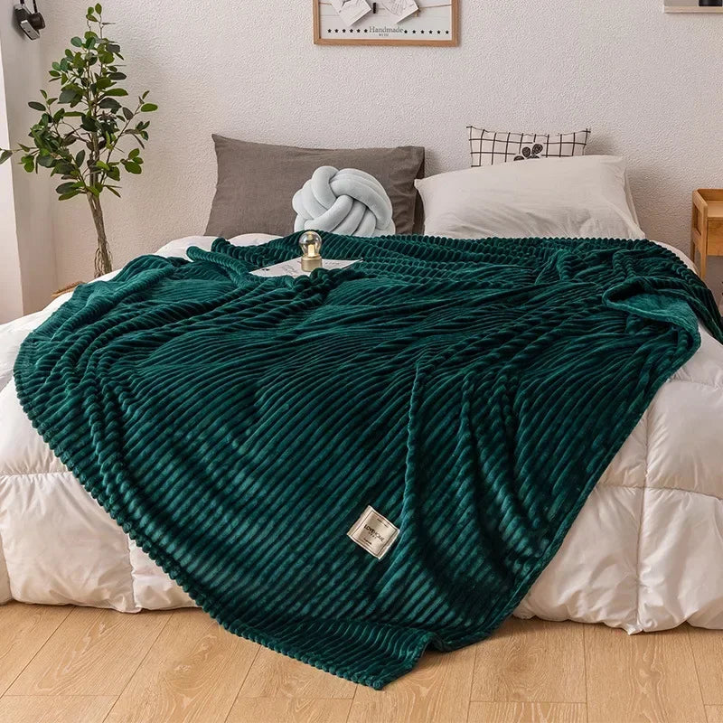 Soft, chunky flannel blanket draped over a sofa, a luxurious and warm home textile.