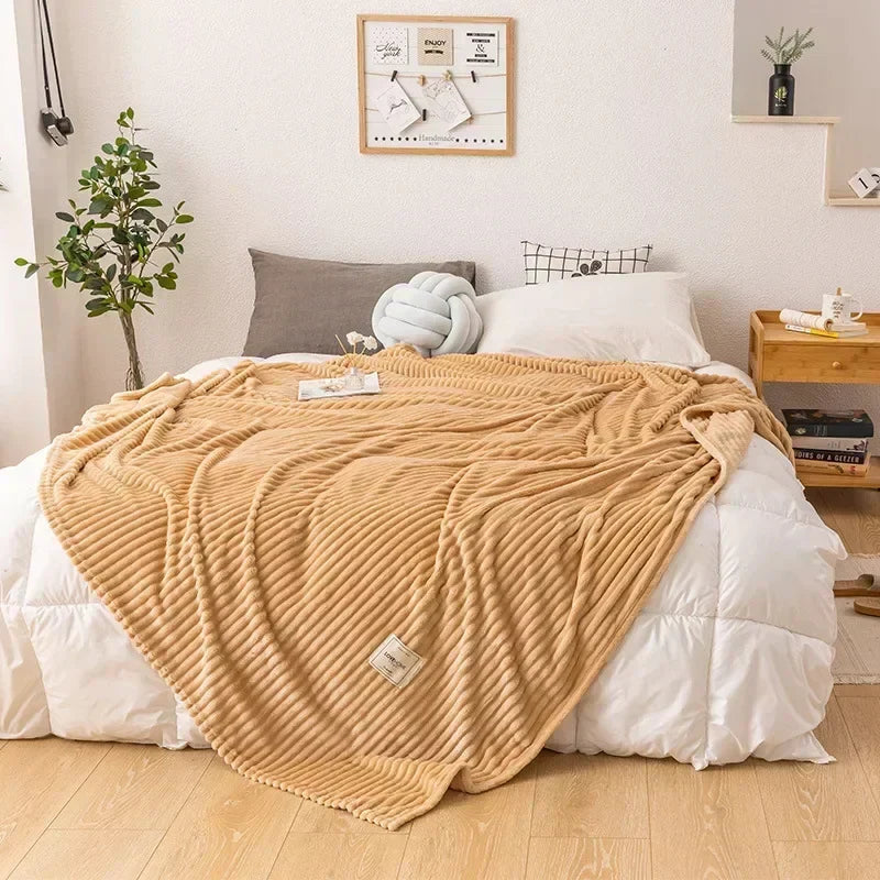 Plush flannel blanket, an inviting home textile for ultimate autumn relaxation.