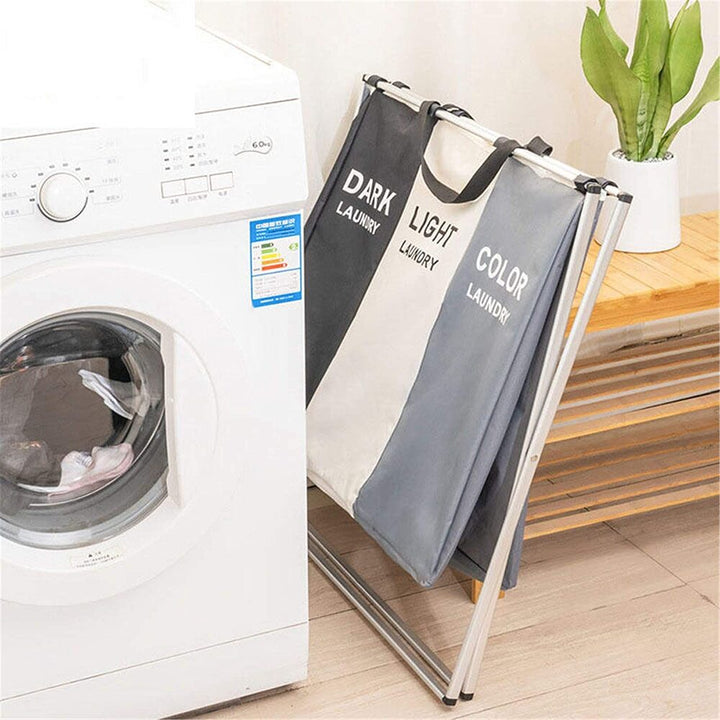 Triple section clothes hamper, durable fabric and sturdy metal frame, perfect for efficient laundry management.