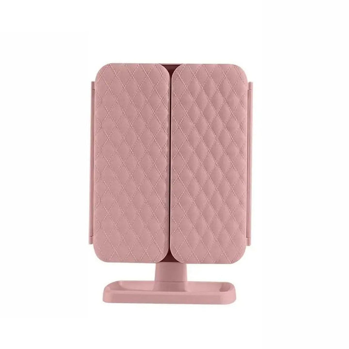 Tri-fold LED makeup mirror on a vanity table, providing optimal lighting for cosmetics.