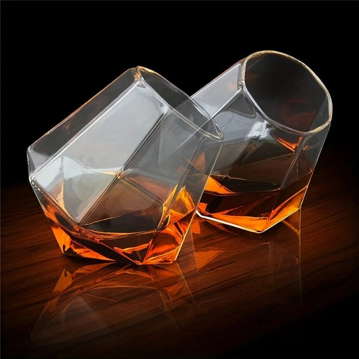 Tilted crystal whiskey glass, unique design for enhanced aroma, luxury barware & spirit tumbler.