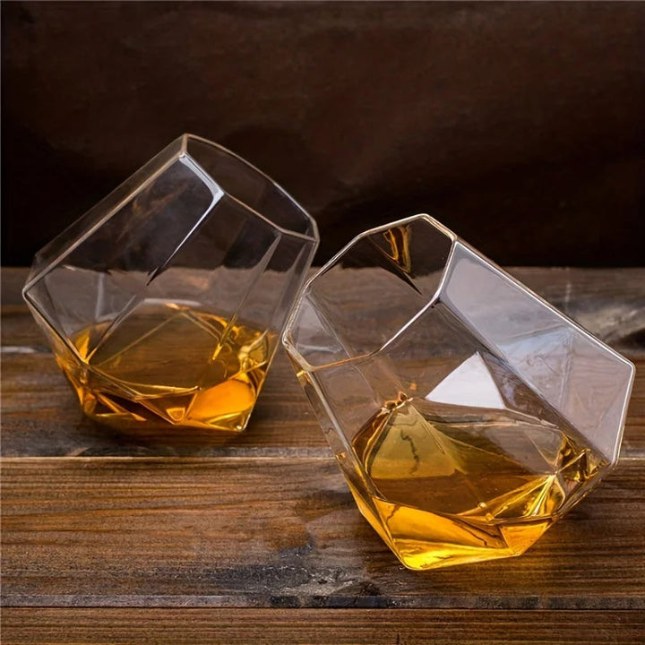 Tilted crystal spirit tumbler for optimal whiskey swirling, sophisticated barware, unique gift.