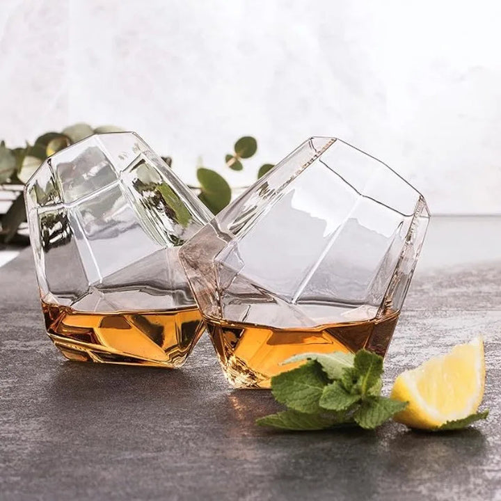 Premium tilted crystal whiskey glass, ergonomic design, enhances flavor, elegant barware for spirits.