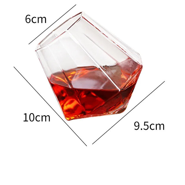 Luxury tilted crystal whiskey glass, modern barware, enhances tasting experience, unique spirit tumbler.