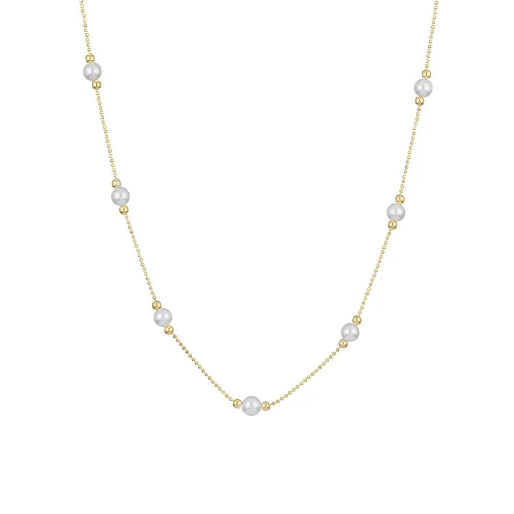 Delicate women's golden necklace with genuine pearls, a timeless and elegant fashion statement.