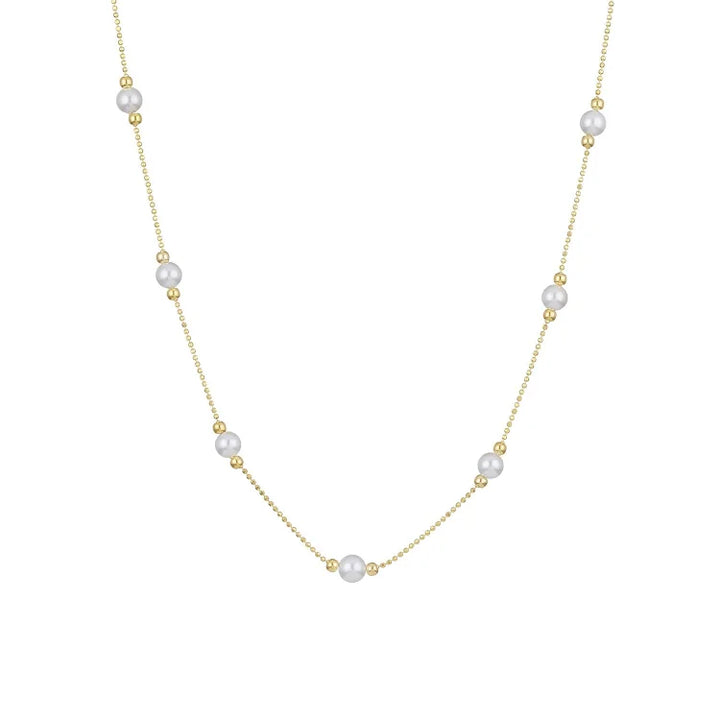 Delicate women's golden necklace with genuine pearls, a timeless and elegant fashion statement.
