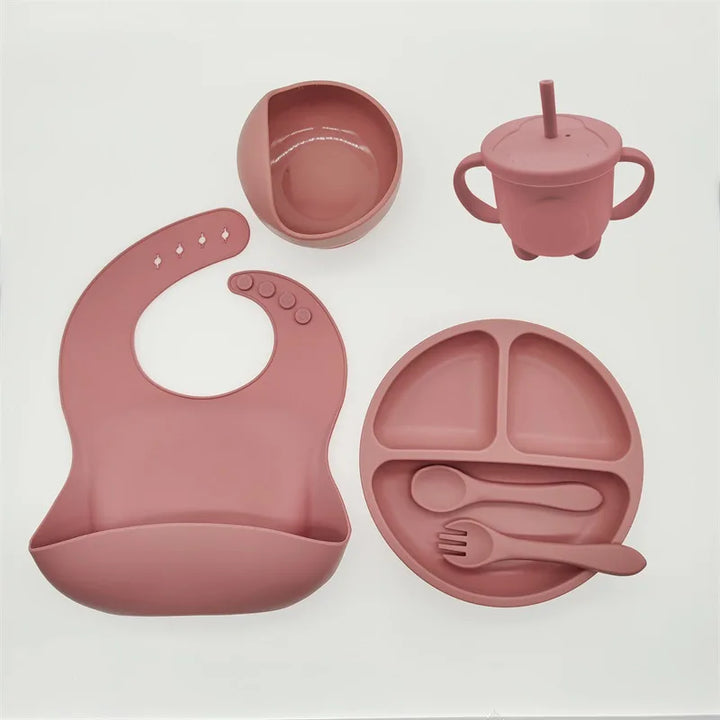 Complete silicone baby mealtime set: non-slip suction plate, bowl, spoon, fork for toddlers.
