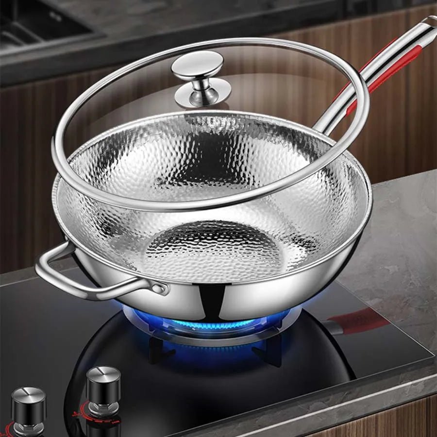 Durable titanium wok with a unique round bottom for induction cooktops; perfect non-stick stir-fry pan.