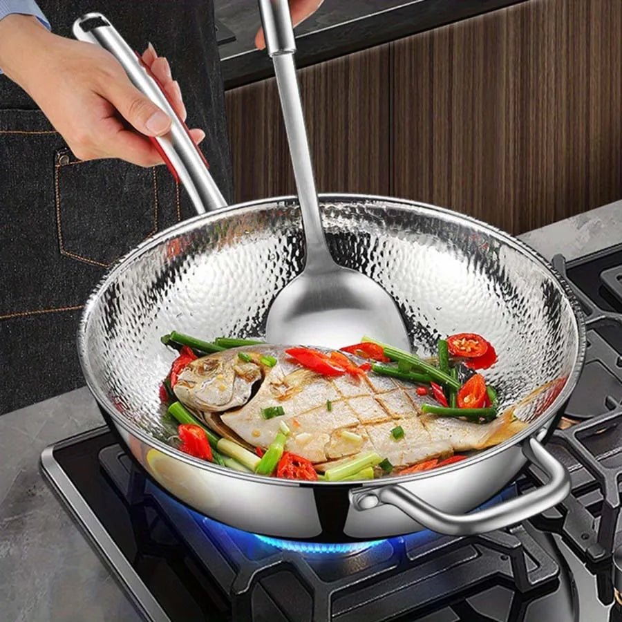 Induction-ready titanium wok, 12-inch round bottom, ensures even heat distribution for stir-frying and sautéing.