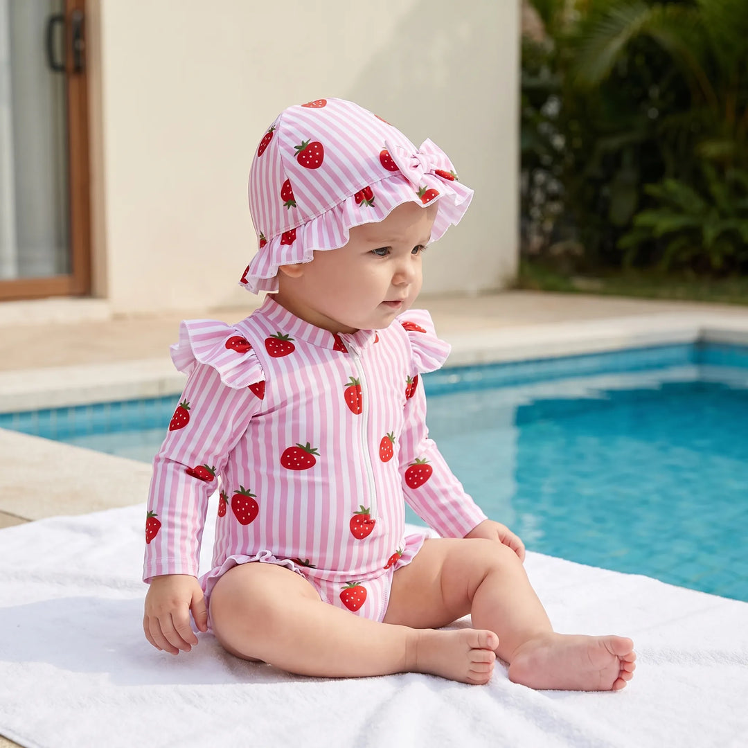 Toddler girl's long-sleeve swimsuit & matching sun hat. UPF 50+ sun protection for beach & pool.