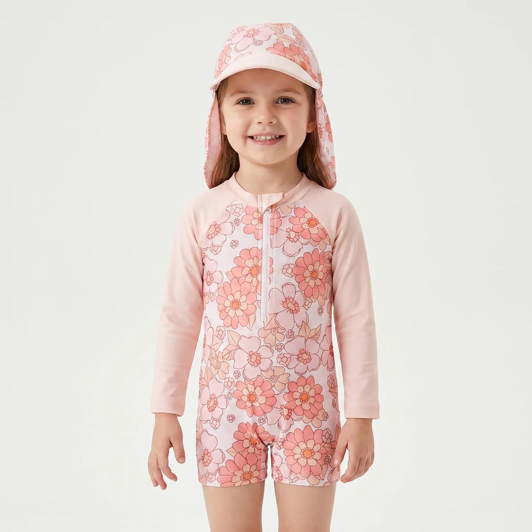 Toddler girls' vibrant floral print rash guard swimsuit and sun hat set, great for sunny beach adventures.
