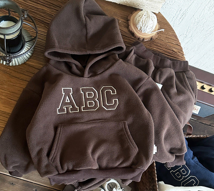 Kids fashion winter outfit, a warm fleece-lined cotton hoodie and pants set for toddlers.