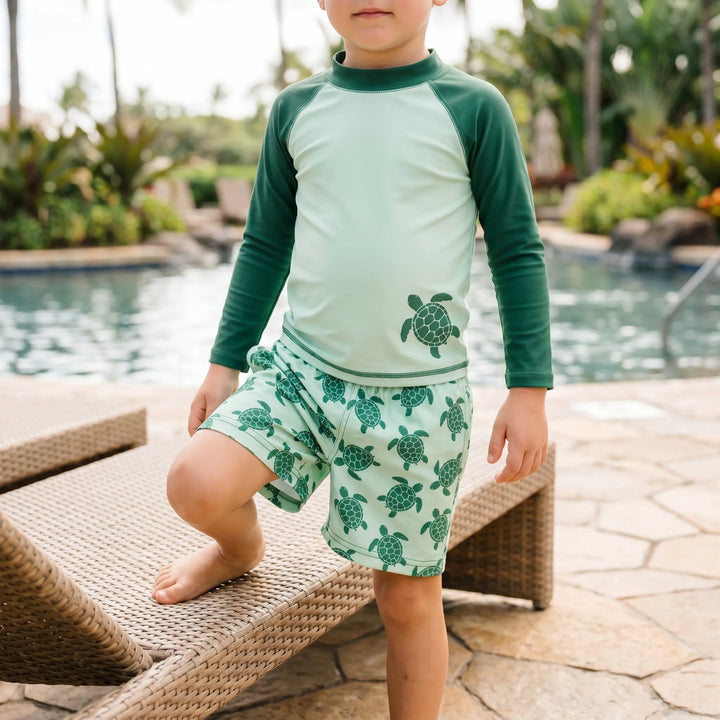 Toddler long-sleeve rash guard swimsuit set in stylish tortoise print. Unisex kids' sun protection swimwear.