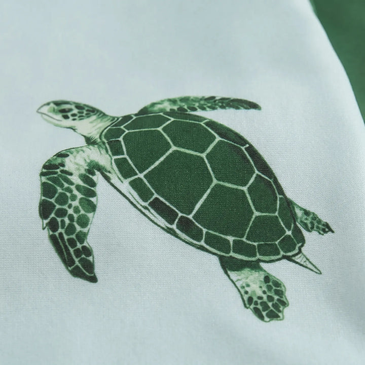 Cute toddler unisex long-sleeve swimsuit set, tortoise print. Perfect kids' beachwear & sun protection.