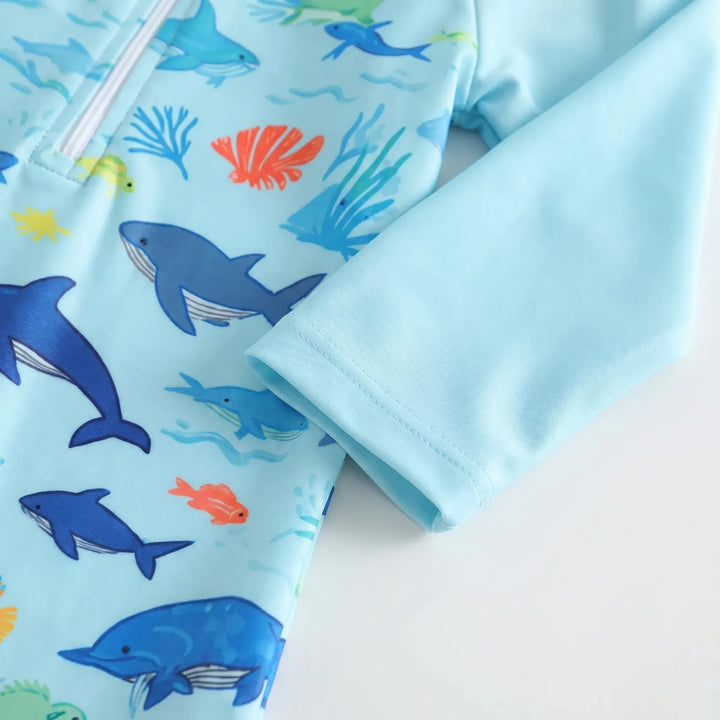 Cute marine print toddler long-sleeve swim romper with matching sun hat. Kids sunsuit for baby's UV protection.