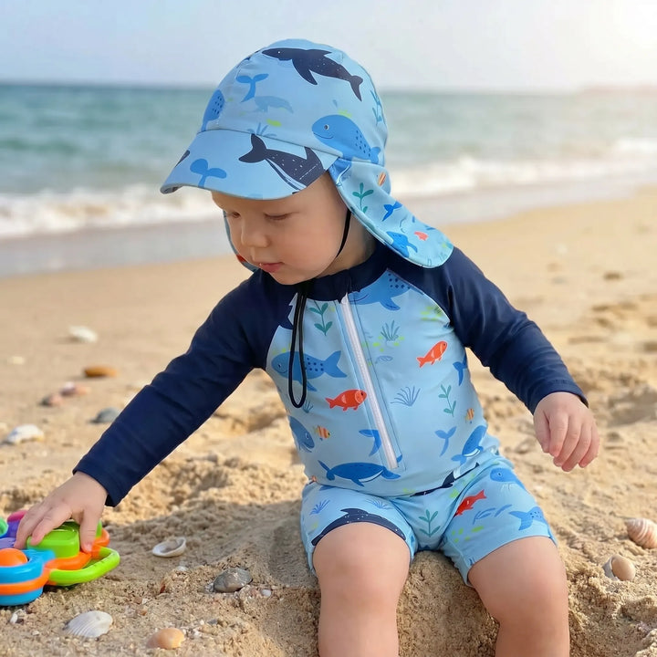 Stylish toddler long-sleeve swim romper & sun hat. Soft, quick-dry fabric for comfortable UV protection during summer.