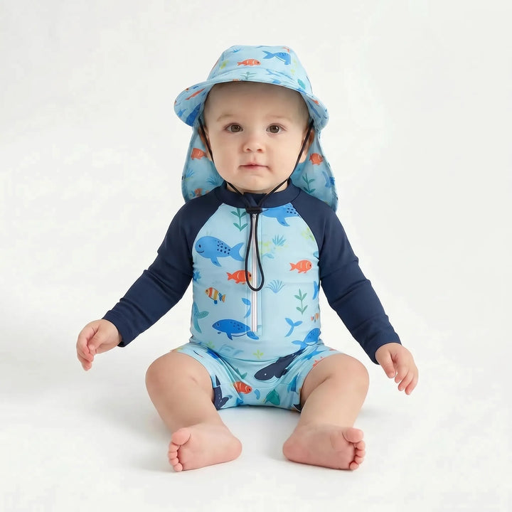 Detail shot: marine print long-sleeve toddler swim romper with matching sun hat, ideal for UV protection.