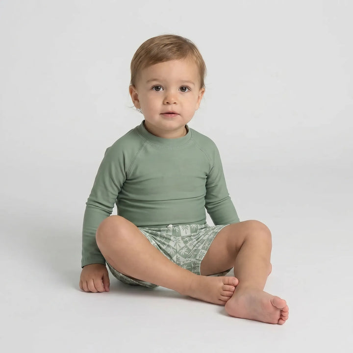 UPF 50+ long-sleeve toddler swim set; two-piece baby rash guard & shorts for ultimate sun safety.