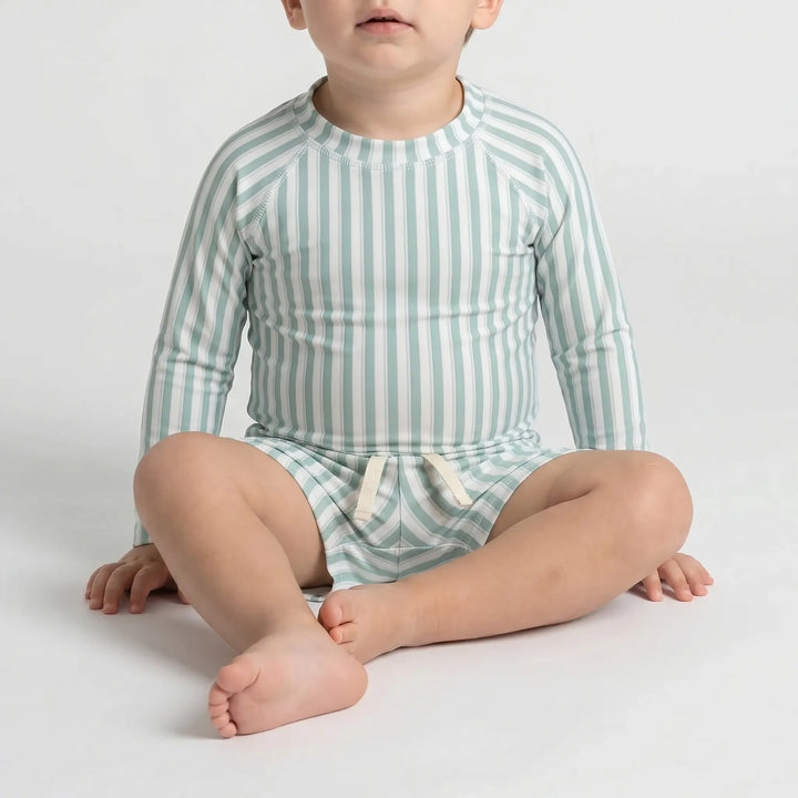 Infant long-sleeve swimwear set, stylish & protective, perfect for toddlers' water play adventures.