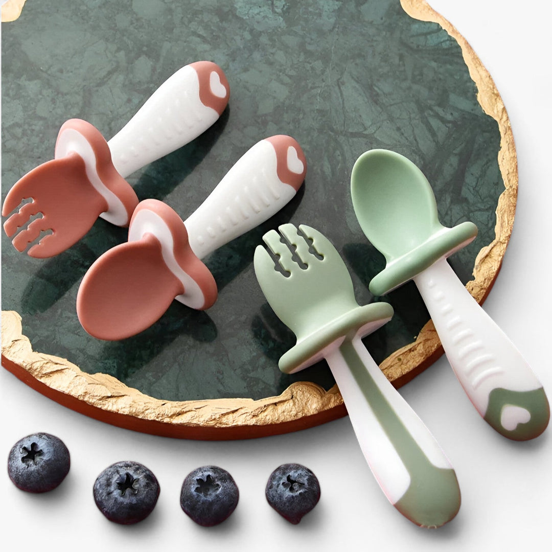 Toddler silicone spoon & fork set for self-feeding. BPA-free baby cutlery in soft, safe silicone. Dishwasher safe feeding set.